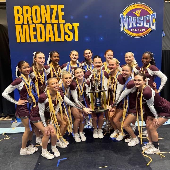 cheerleaders with trophy 