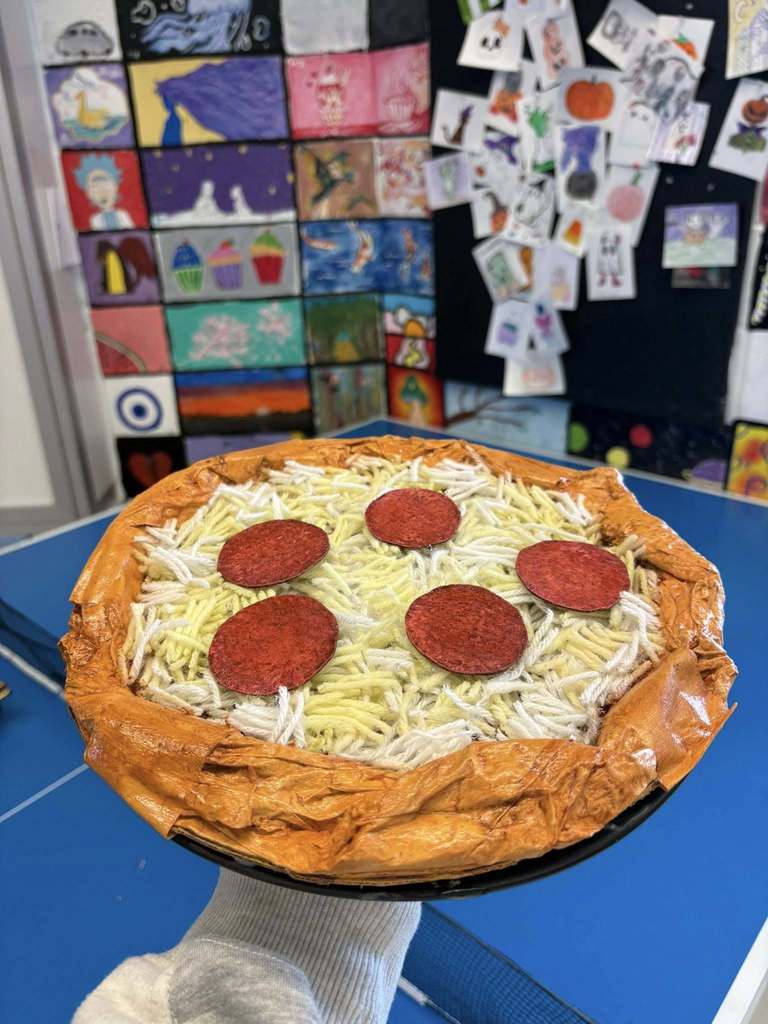 A sculpture made to look like pepperoni pizza. 