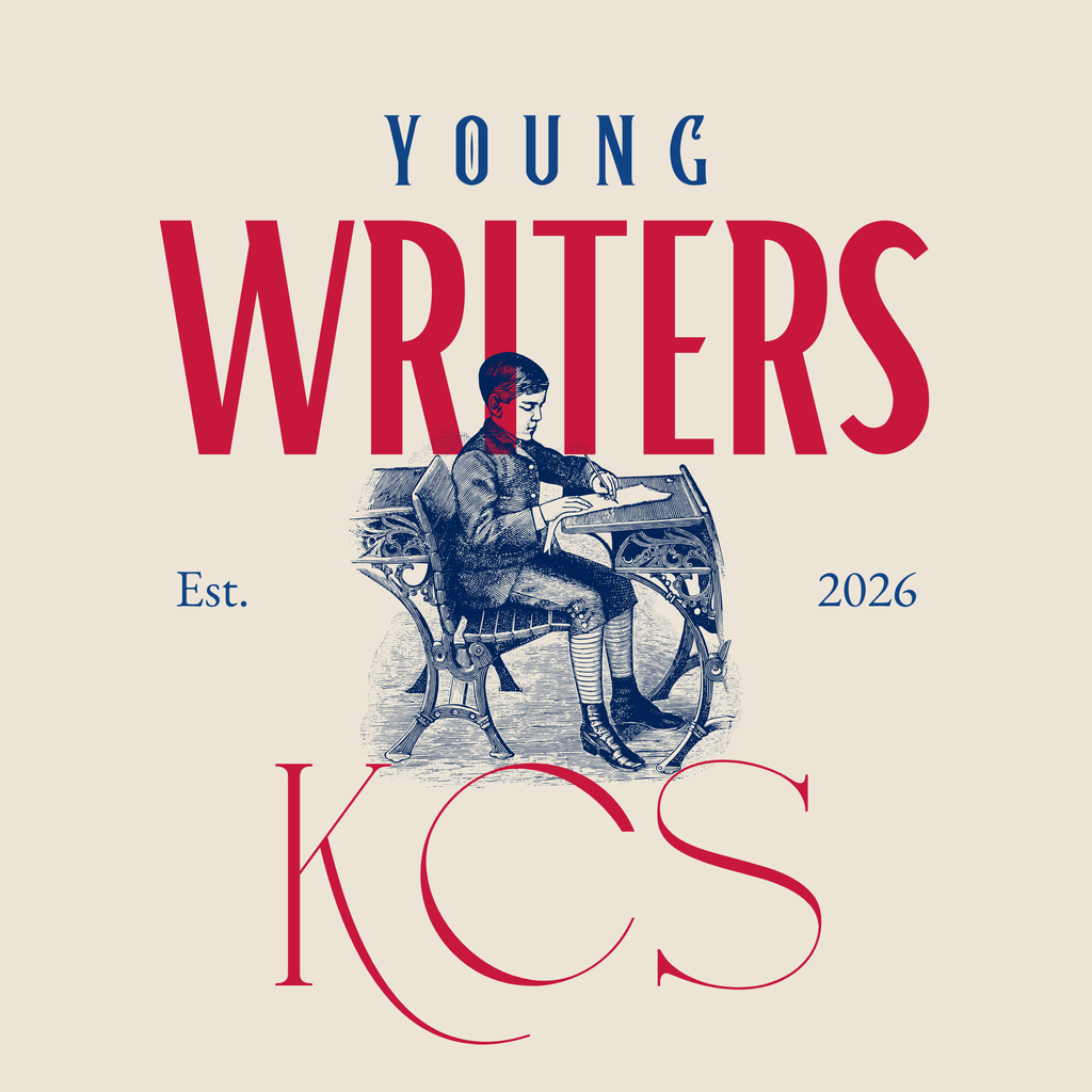 An illustration of a young boy writing on paper while sitting at a vintage writing table. Above the illustration are the words Young Writers and below the illustration it says KCS. On either side of the illustration it says Est. 2026, denoting the 2026 KCS Young Writers winners.