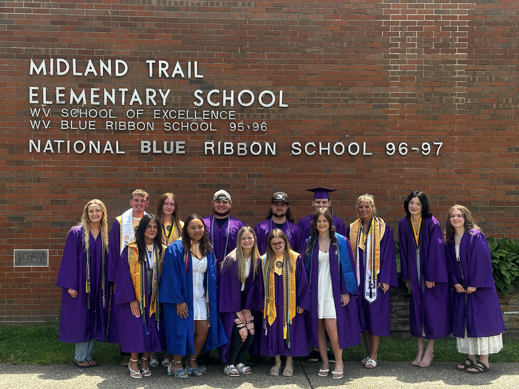 Graduates in front of Midland Trail.