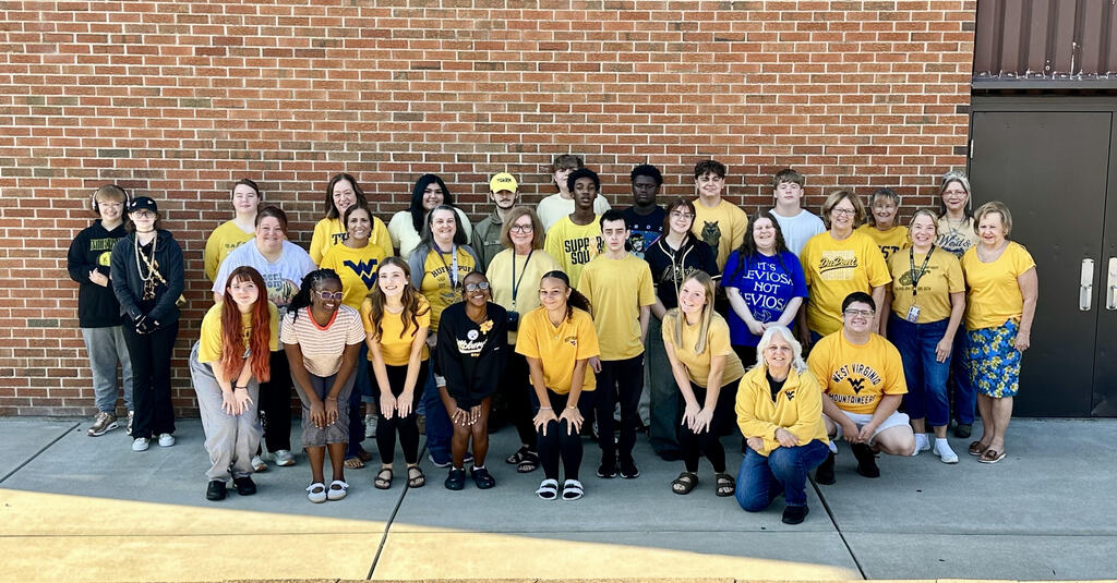 Group of Carver Staff and students wearing gold to show their support for battling childhood cancer