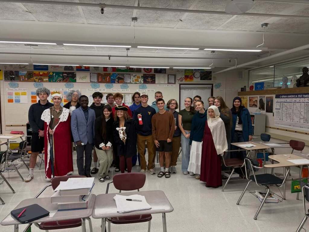 Students in their classroom dressed up as leaders from the  American Revolution.