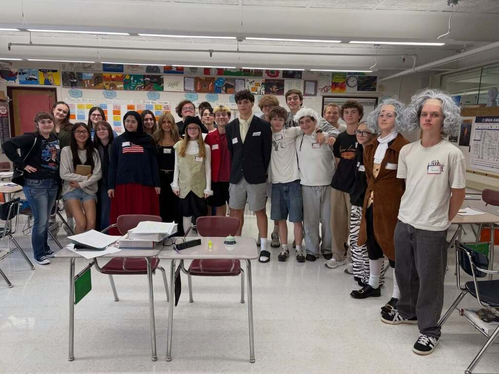 Students in their classroom dressed up as leaders from the  American Revolution.