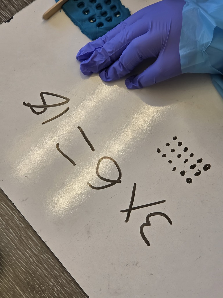 a white board with 3 times 6 = 18 written on it.