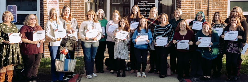 some of the elementary teachers that were recognized for their outstanding work during the 1st nine weeks posing for a picture outside of KCS central office.