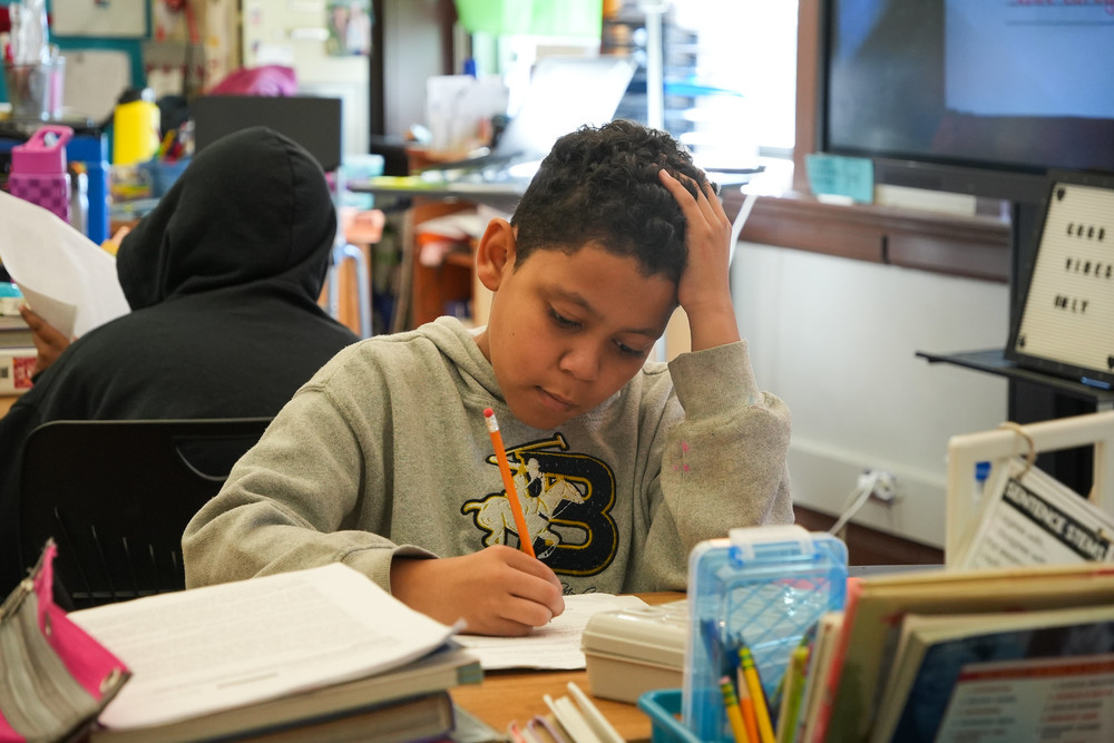 Student working on his schoolwork