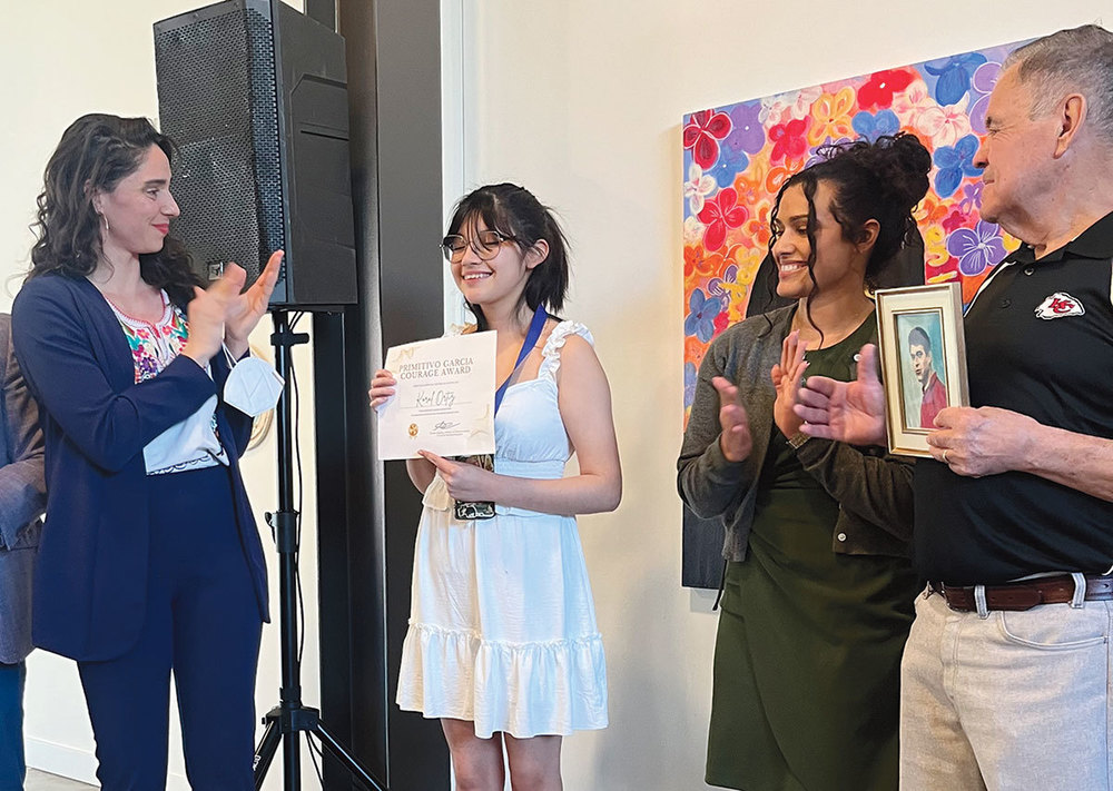 Student accepts the Primitivo Garcia award last year