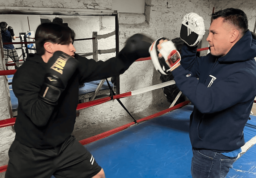 A student spars with an instructor as part of Northeast High School's new boxing program.