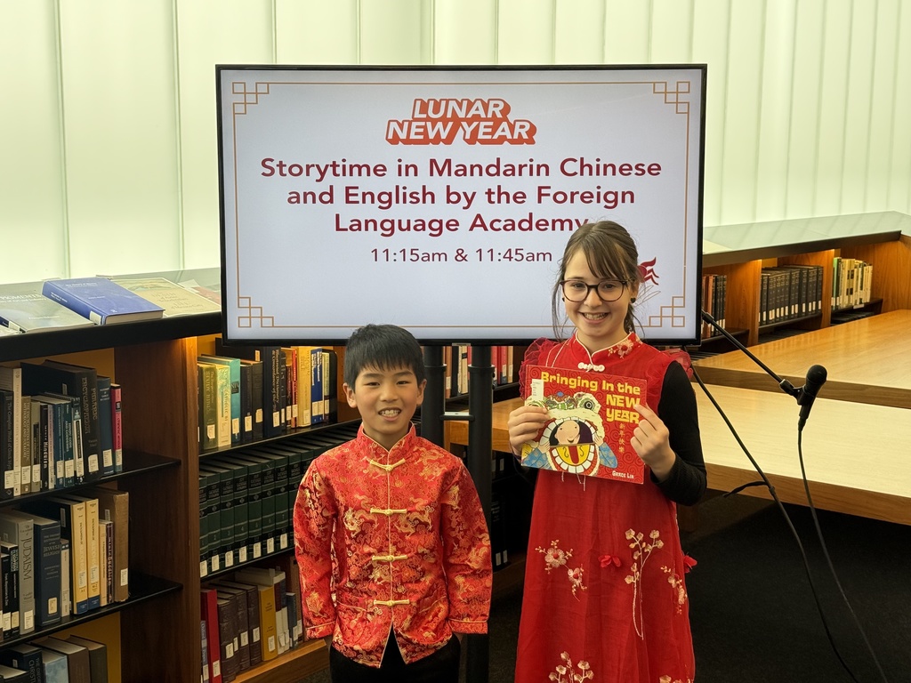 FLA students in Lunar Near Year clothing with books.