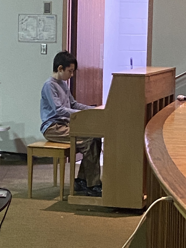 Student playing piano