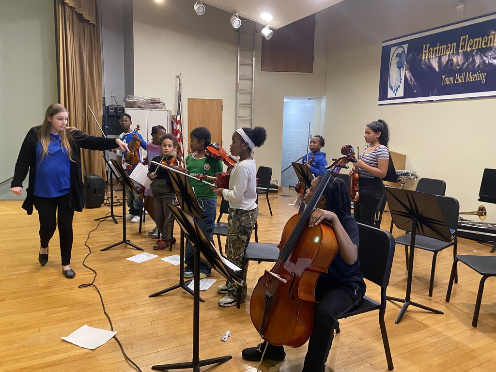 Band and Orchestra students playing stringed instruments