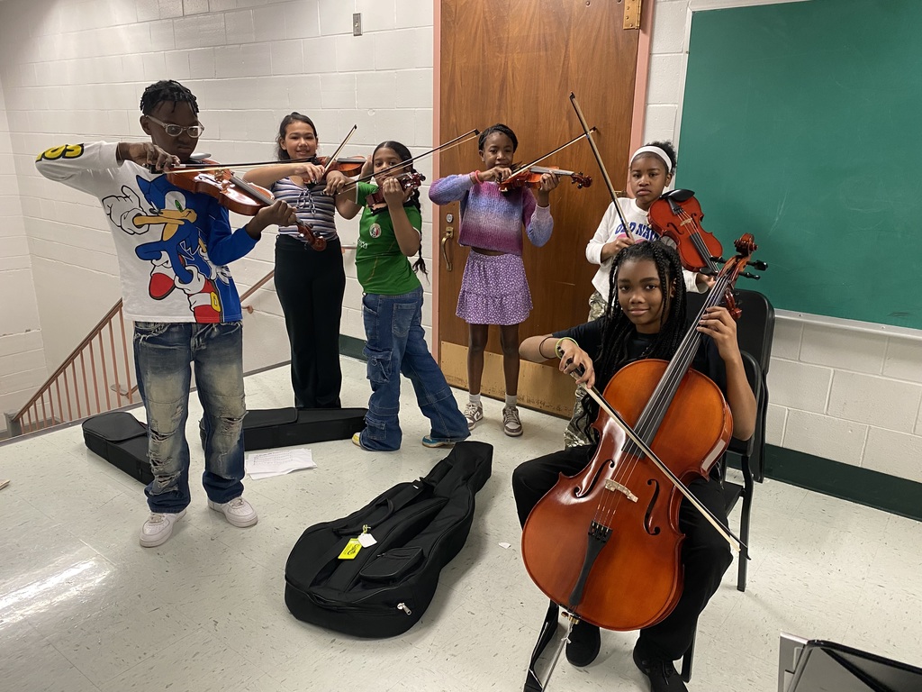 Band and Orchestra students playing stringed instruments