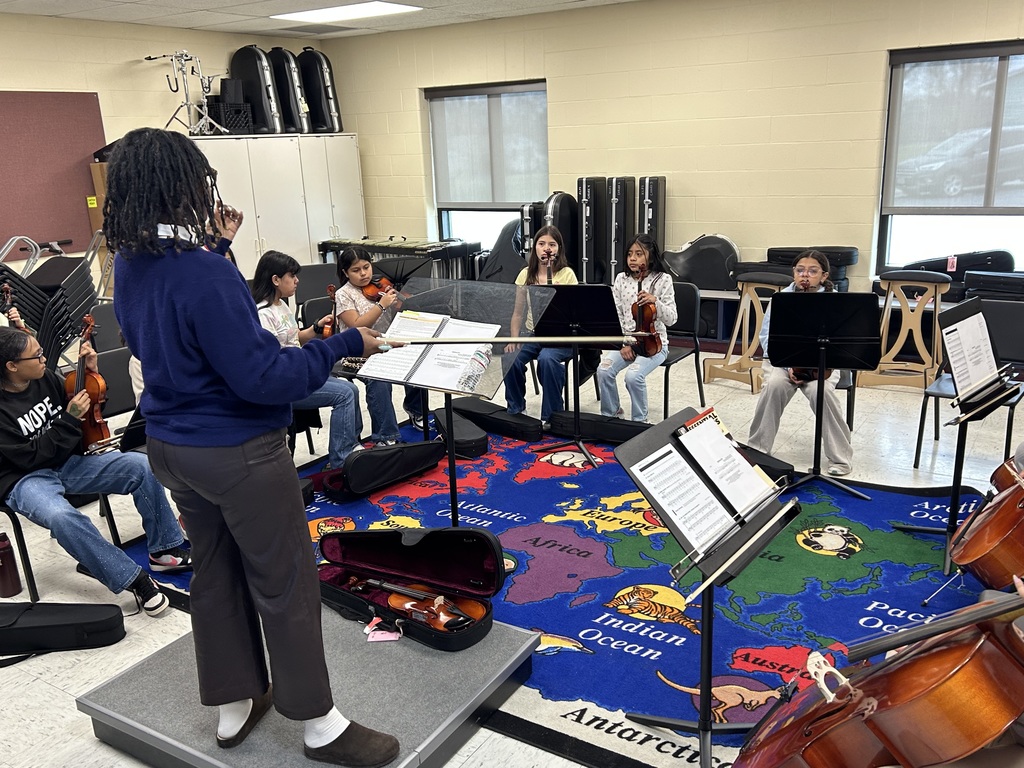 Ms. Riz conducting a class