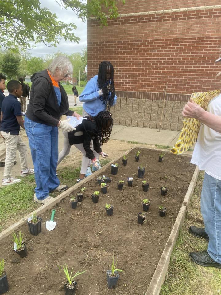 student planting for Earth Day