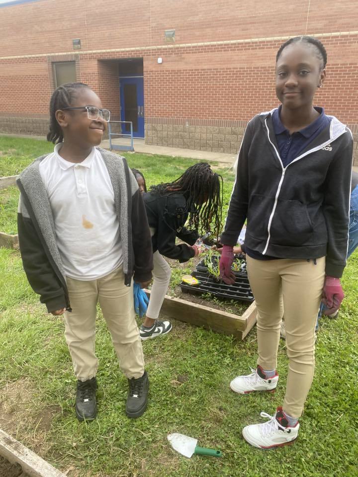 student planting for Earth Day