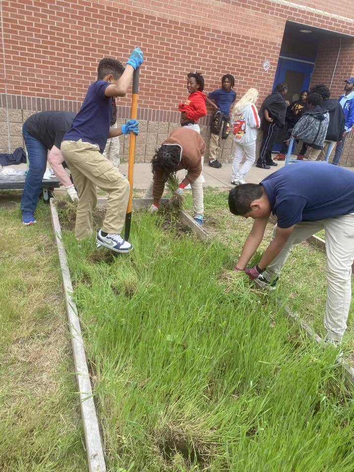 student planting for Earth Day