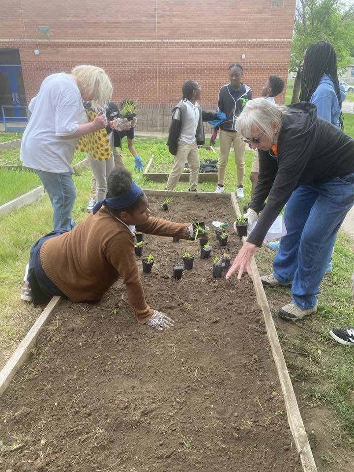 student planting for Earth Day