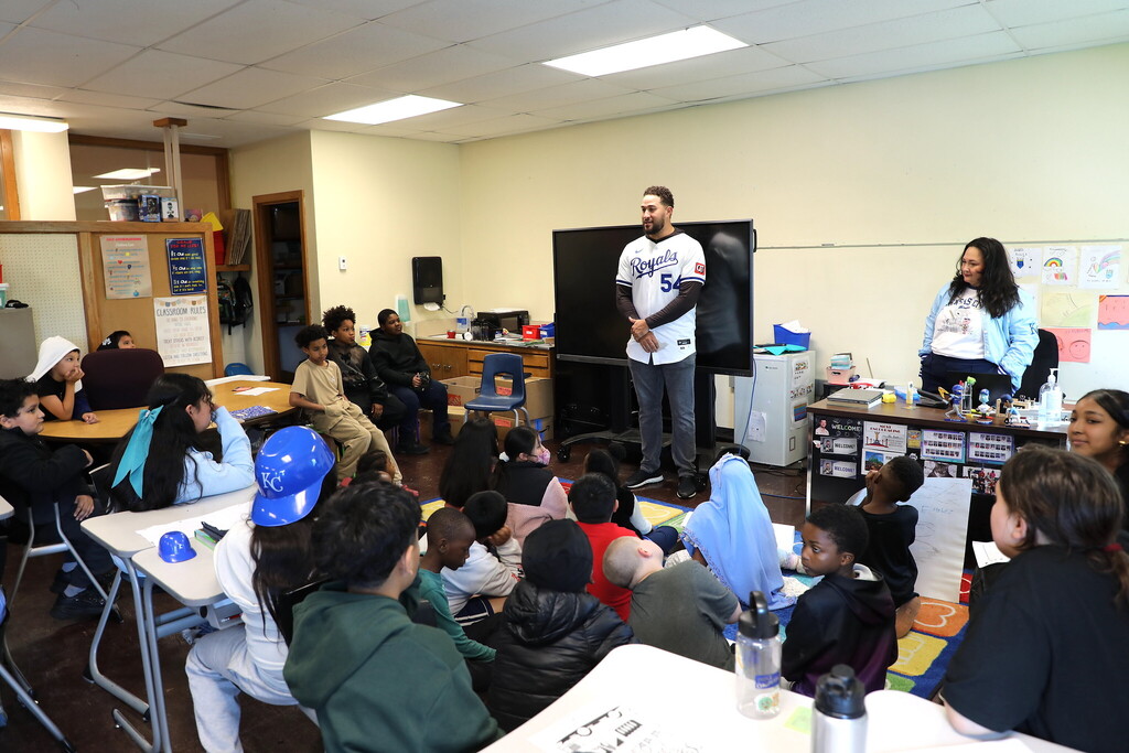 Royals player Carlos Estévez stands before a class of students at Whittier Elementary as part of the Royals Literacy League
