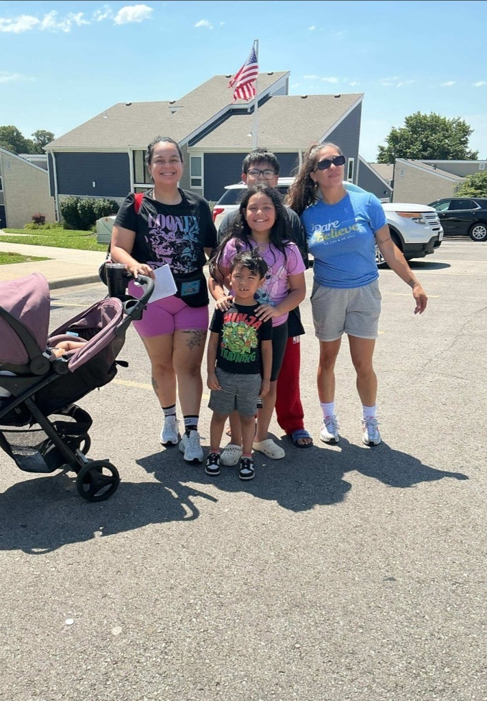 KCPS Family & Community Engagement Liaisons out in the community during summer break, interacting with family and students. The team is handing out pantry staples and ice cream to support and connect with the community.