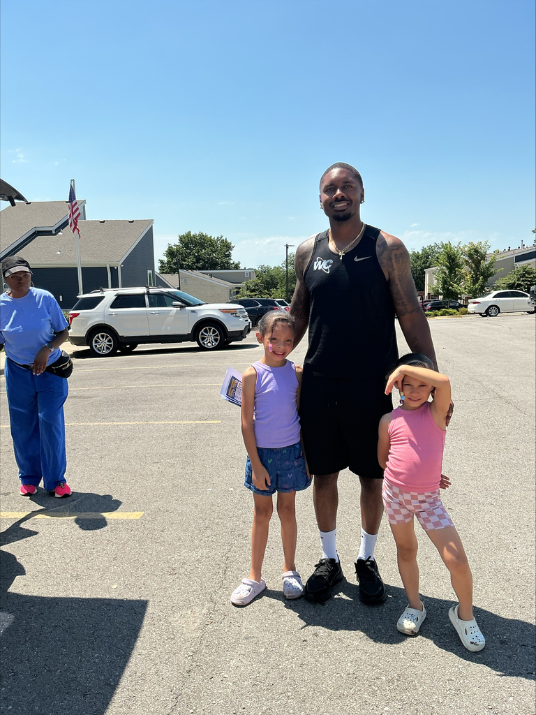 KCPS Family & Community Engagement Liaisons out in the community during summer break, interacting with family and students. The team is handing out pantry staples and ice cream to support and connect with the community.