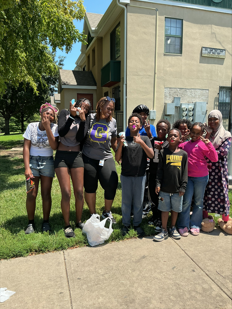 KCPS Family & Community Engagement Liaisons out in the community during summer break, interacting with family and students. The team is handing out pantry staples and ice cream to support and connect with the community.