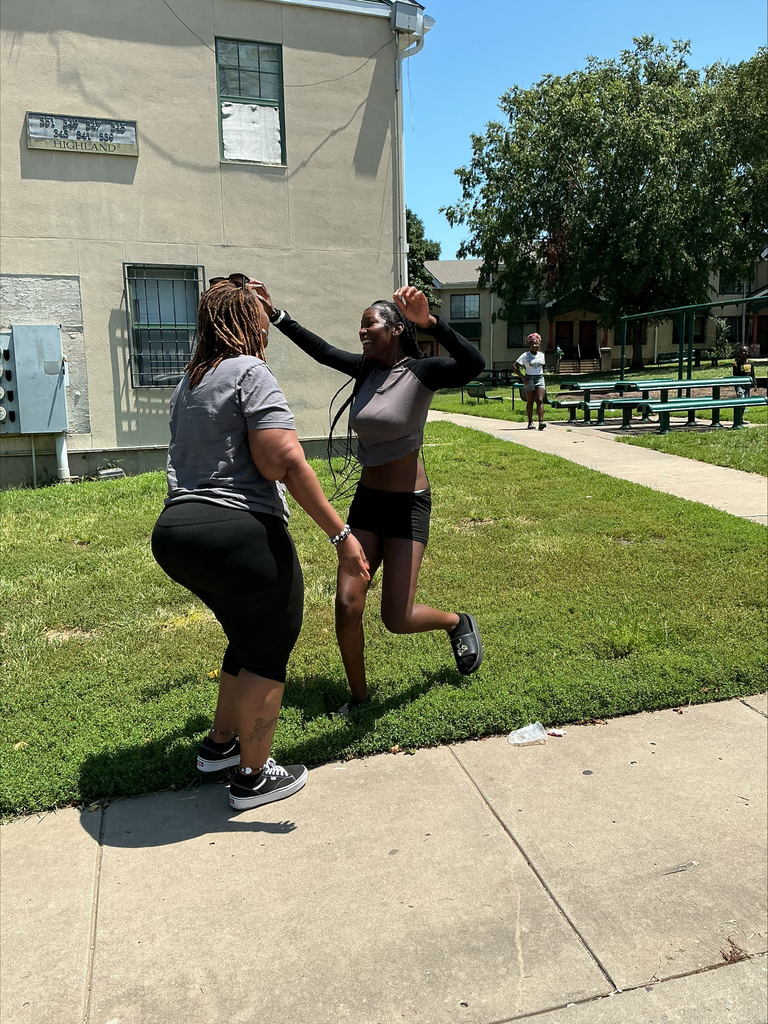 KCPS Family & Community Engagement Liaisons out in the community during summer break, interacting with family and students. The team is handing out pantry staples and ice cream to support and connect with the community.