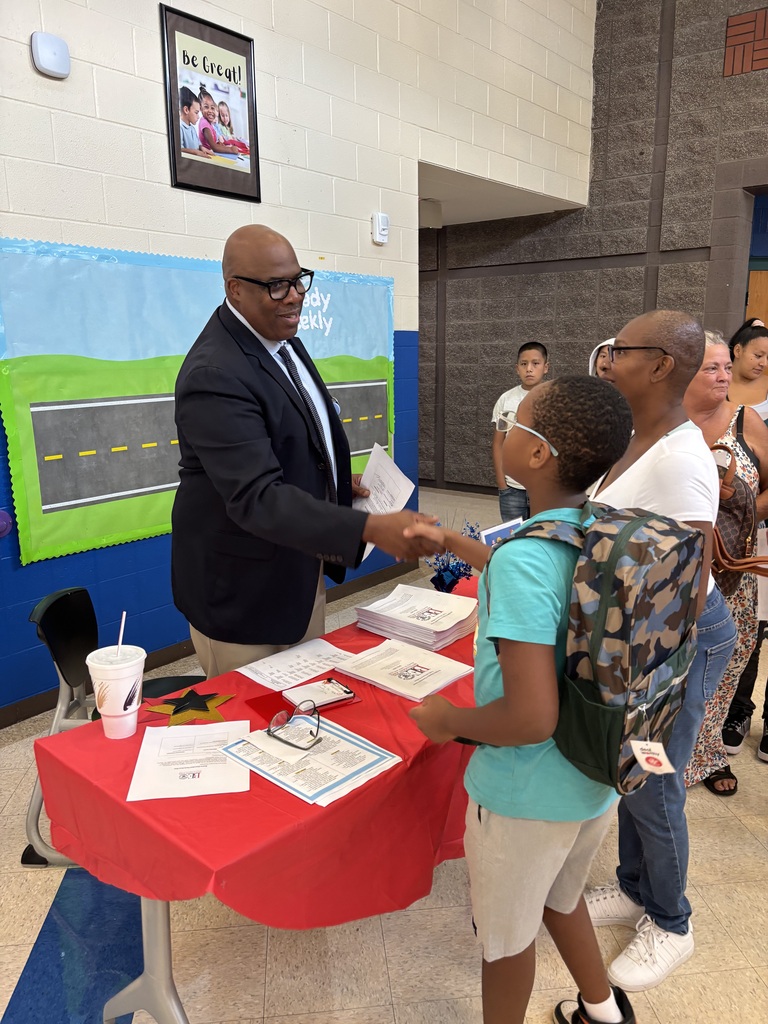 Mr. Wren greets students.