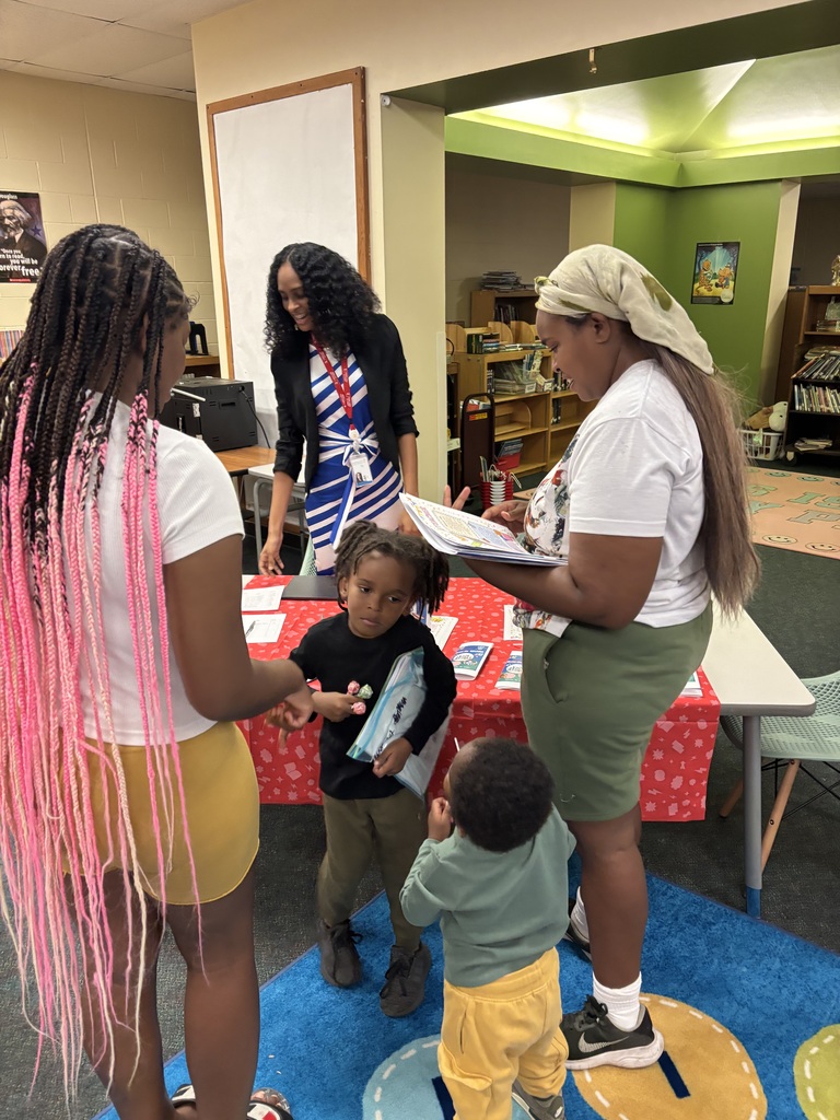 Ajarie greeting students.