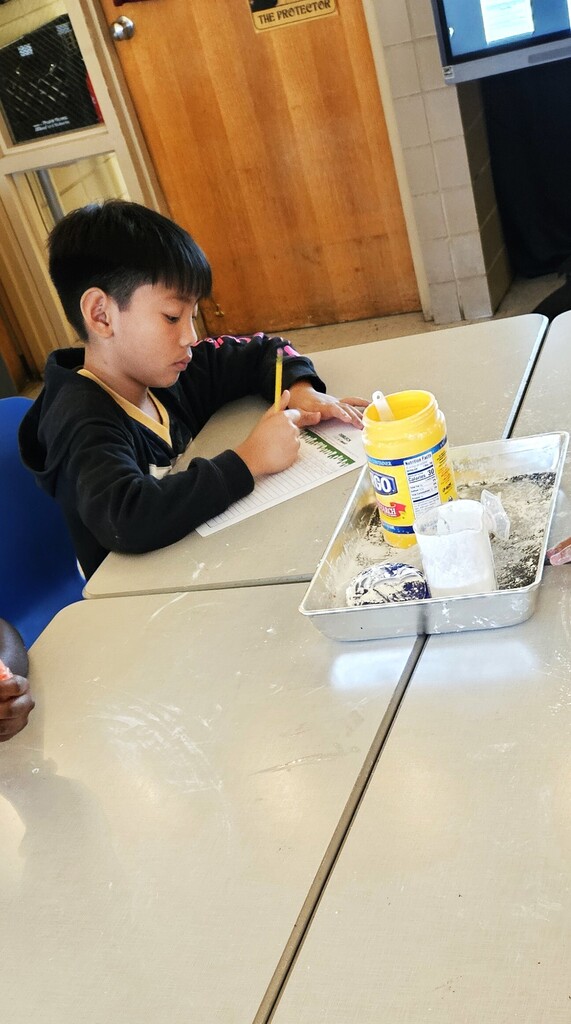 student taking notes
