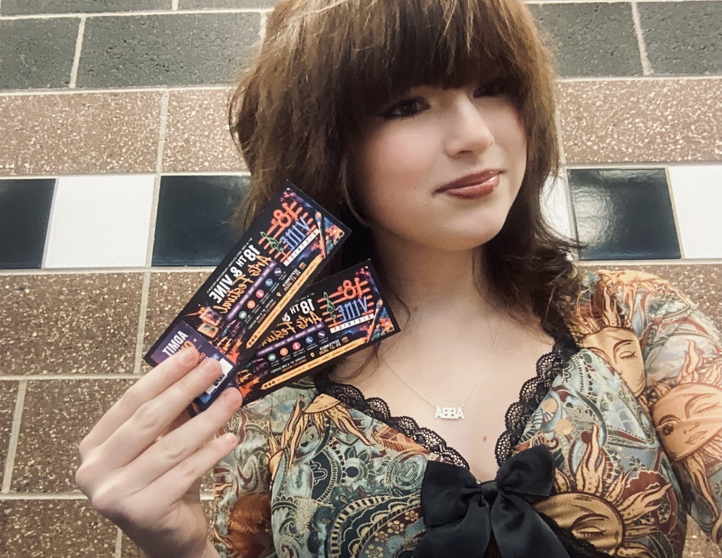 Student holding tickets