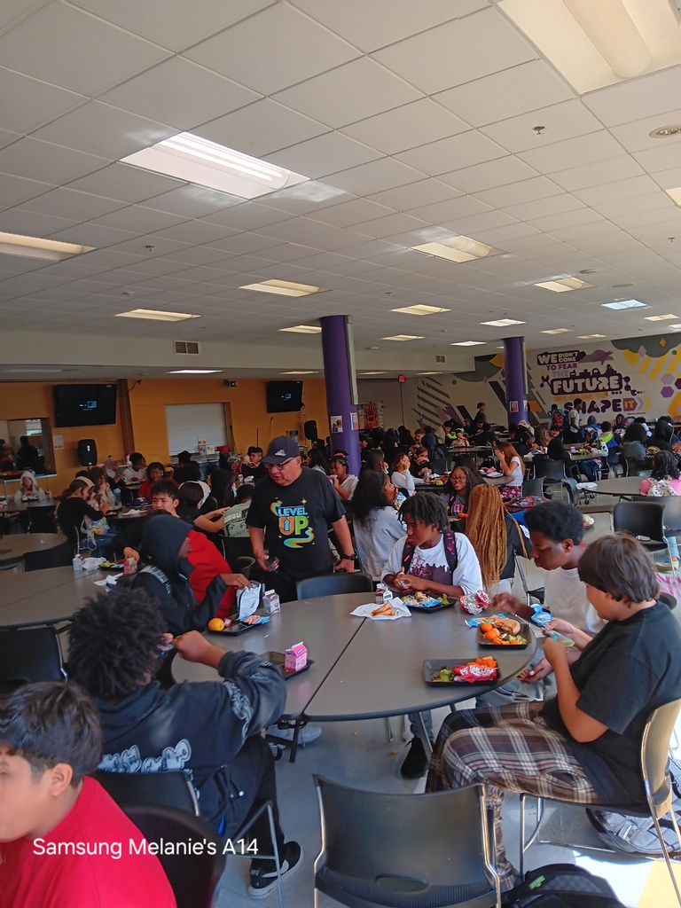 students have returned to school and are filling the cafeteria will smiles and their bellies with food