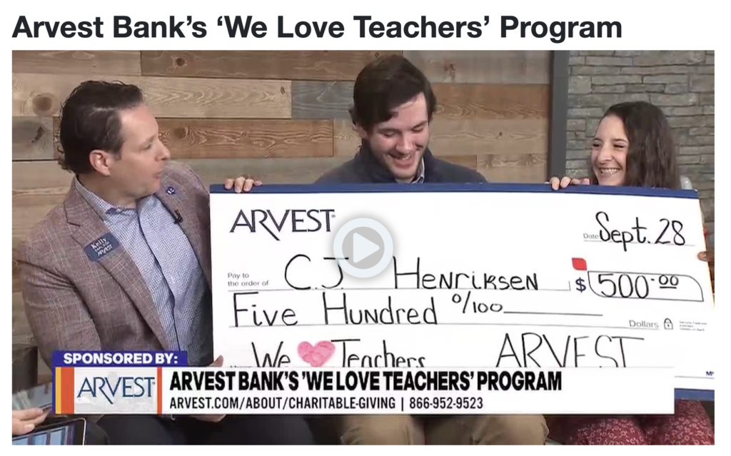 Mr. Henriksen being awarded his check from Principal Zirkel