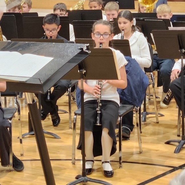 Bailey plays clarinet