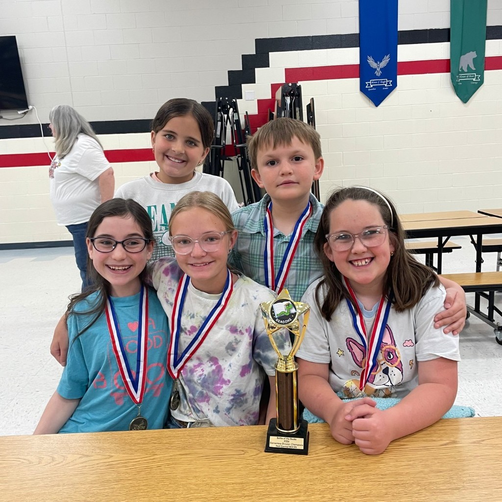 students pose with trophy