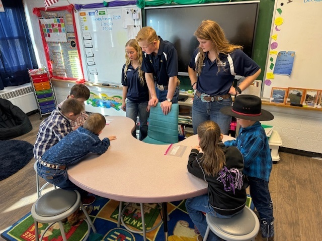 FFA members teach K-2 students in the elementary classroom.