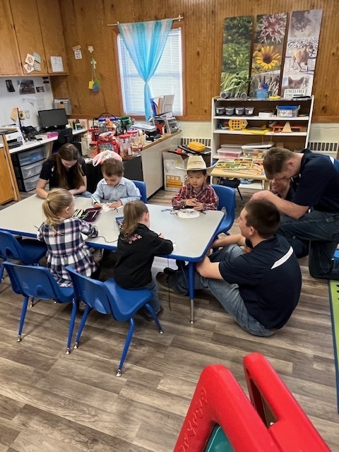 Preschoolers craft animal masks with help from FFA members.