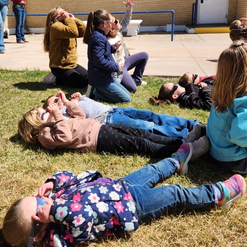 elementary students gaze at the solar eclipse