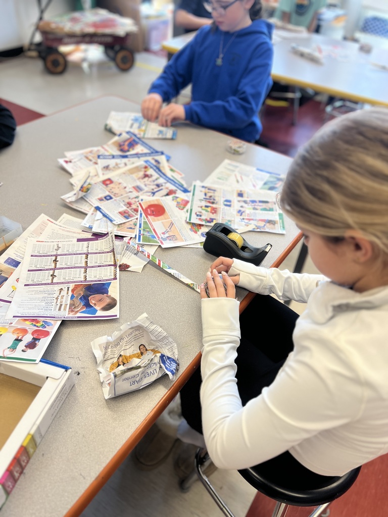 student making art with paper and tape