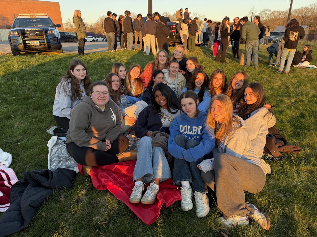 students sitting on the ground