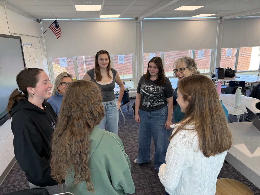 students standing in a circle