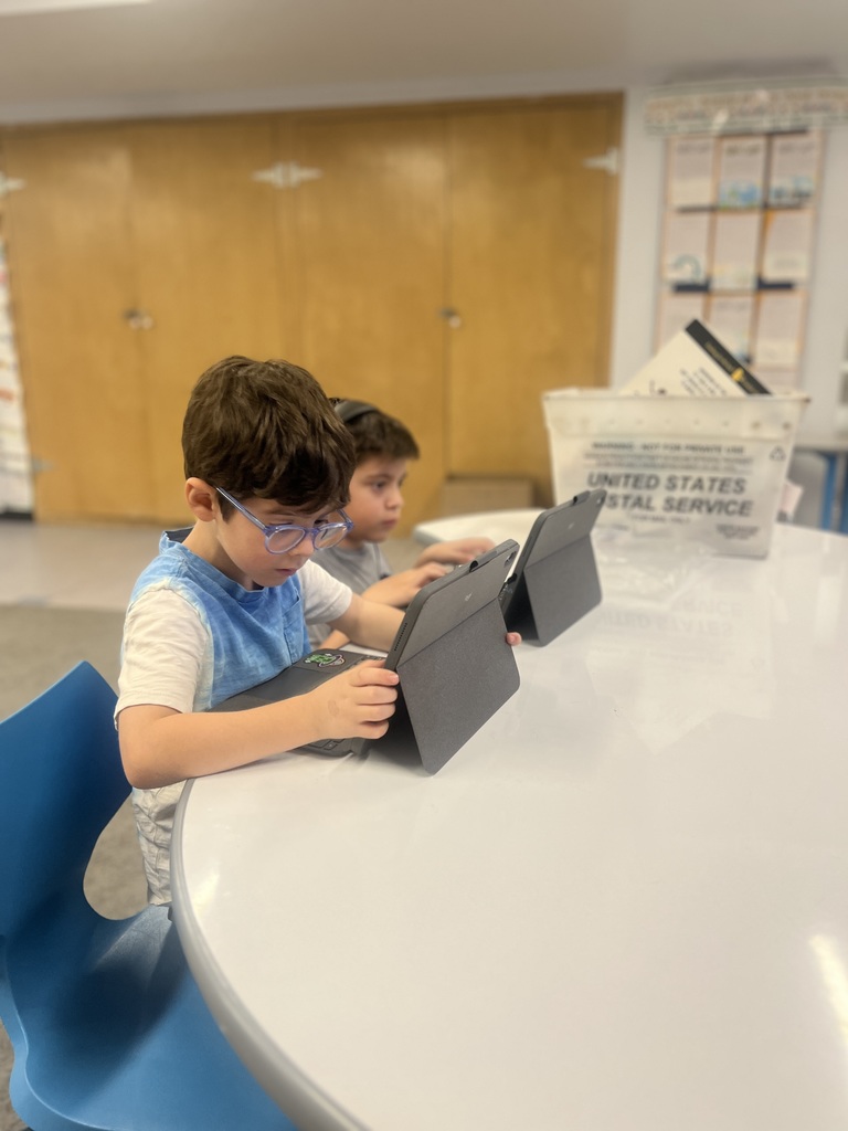 students looking at ipads