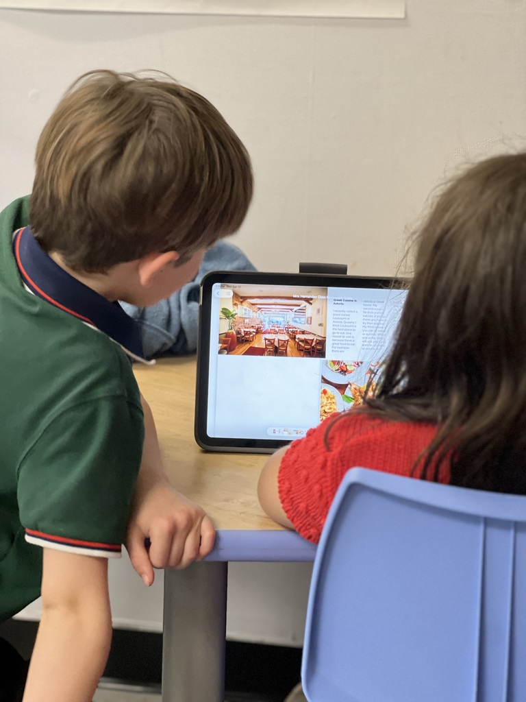 students looking at ipad