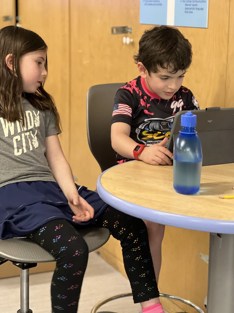 students looking at ipad