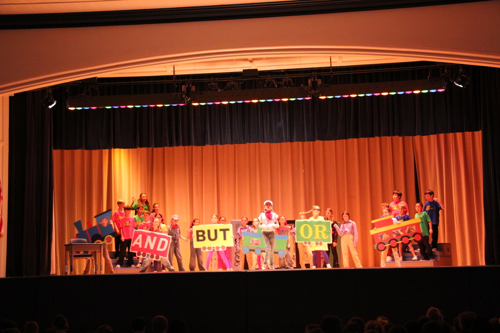 students standing on stage