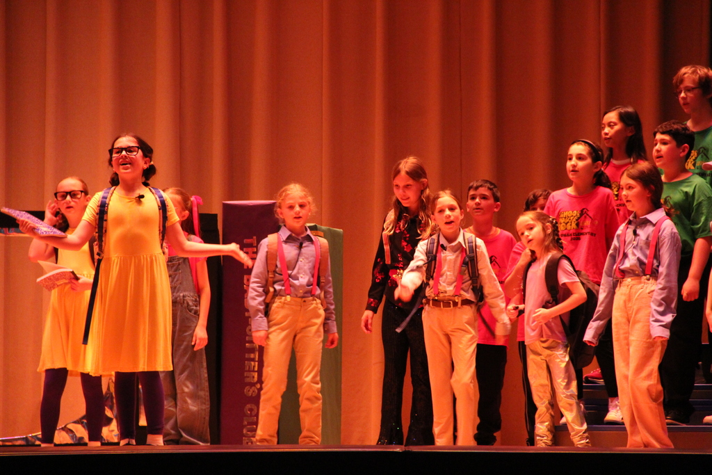 students standing on stage