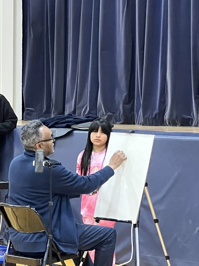 student standing author sitting sketching