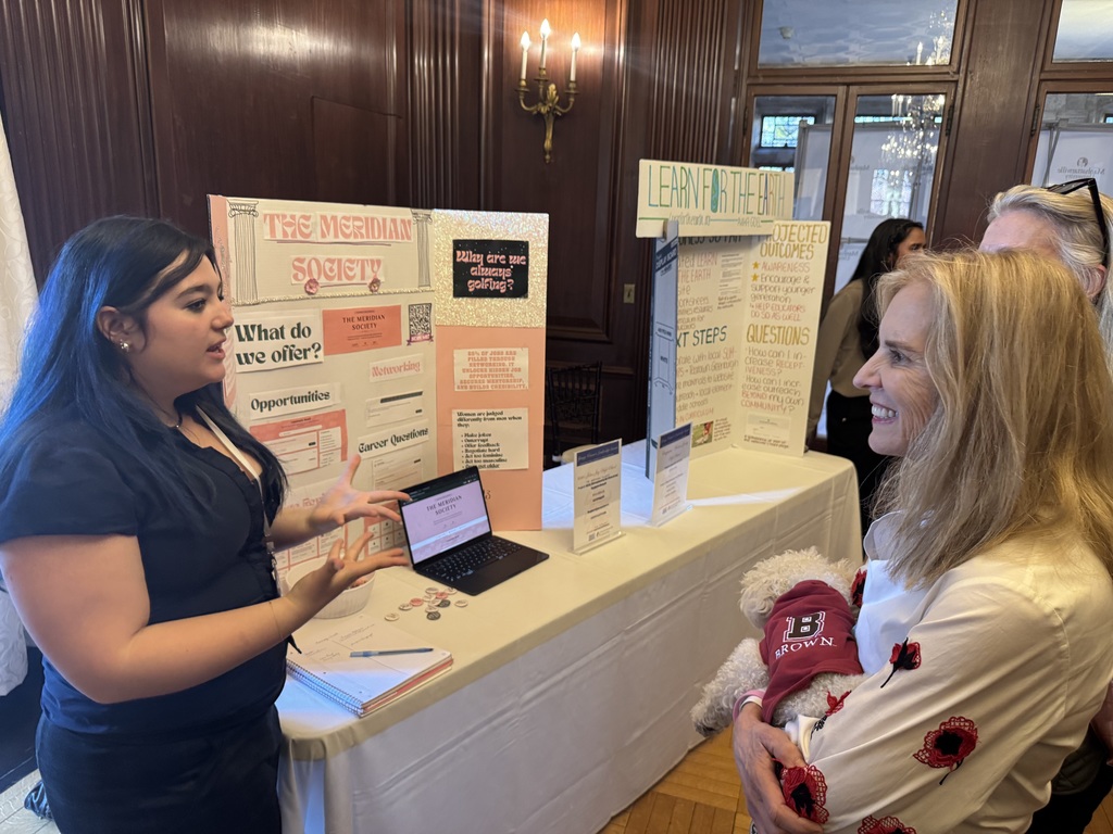 student standing talking with adult standing