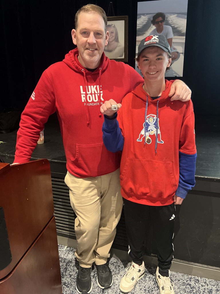 student standing  and adult standing 