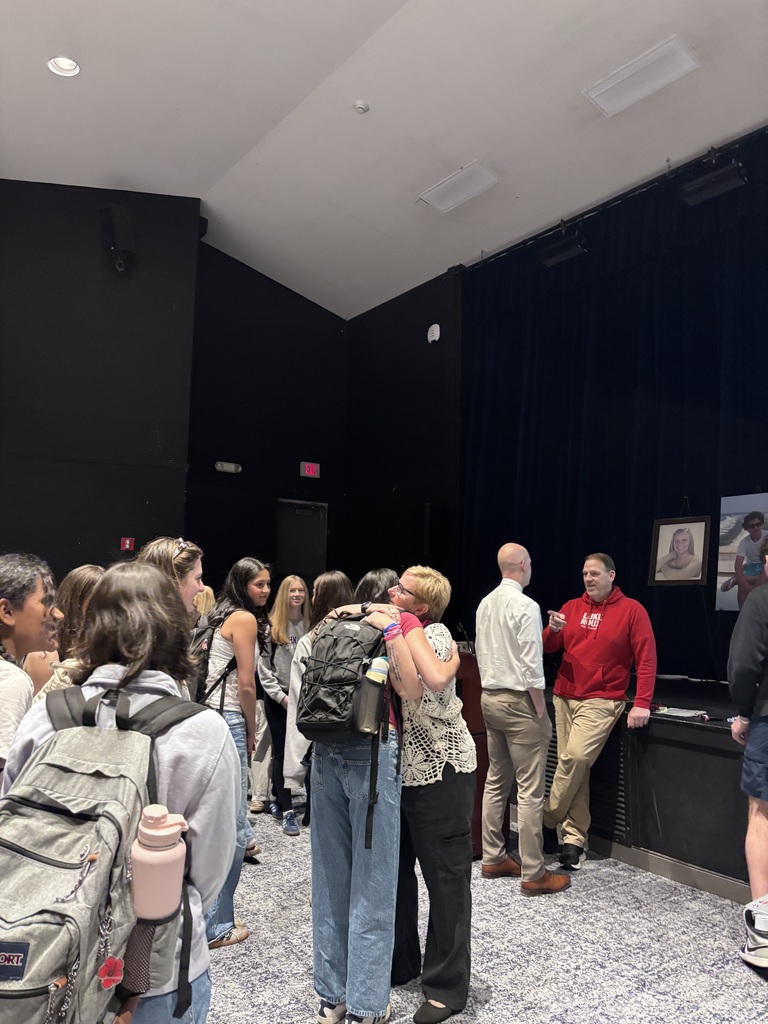 students standing  and adults standing 