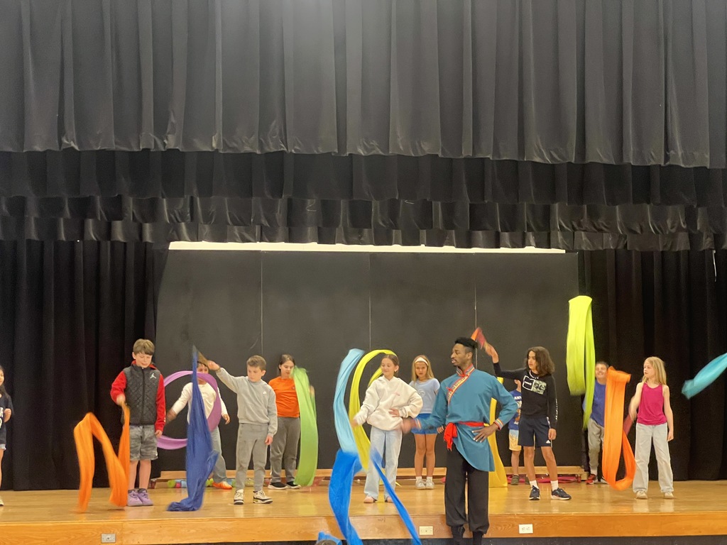 students on stage dancing 